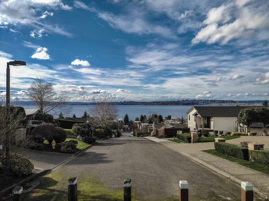Residential street with homes and a view of Lake Washington in Kirkland