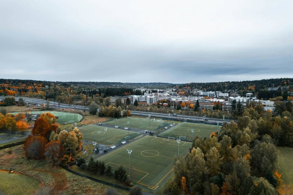 Aerial view of sports fields surrounded by evergreen trees in Redmond Washington