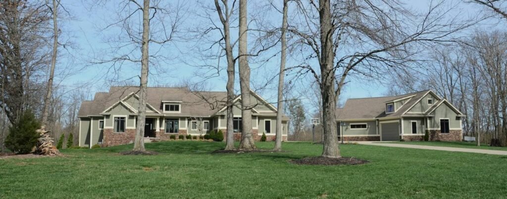 Two homes on large grassy lots with mature trees typical of Snohomish acreage properties